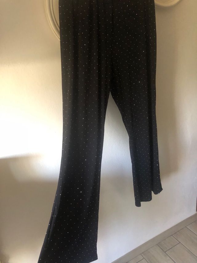 Pantaloni a zampa con brillantini