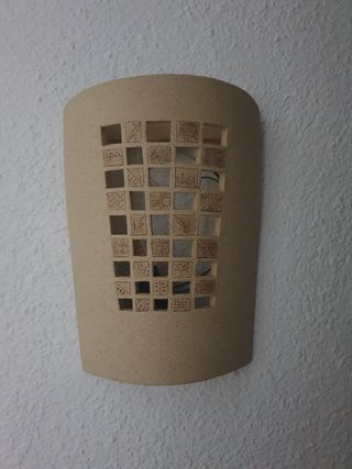 Aplique de pared de piedra con diseño