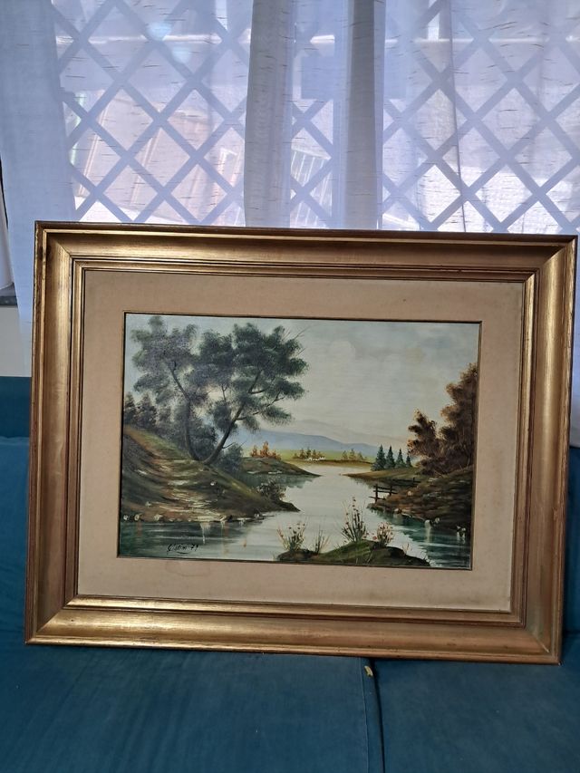 Quadro paesaggio fiume con cornice dorata