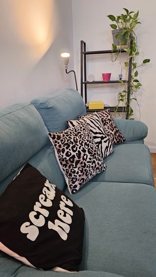 Sofá turquesa de tela en perfecto estado