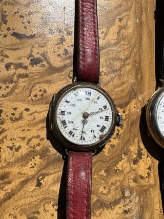 2 orologi Trench