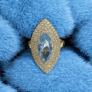 Lanzadera piedra azul y circonitas de oro de 18k
