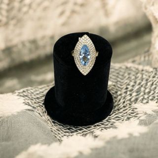 Lanzadera oro de 18k circonitas y piedra azul 