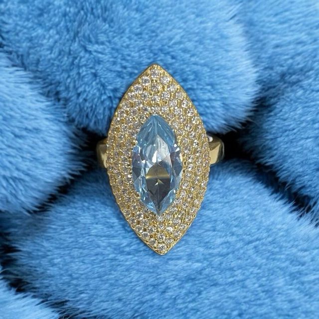 Lanzadera oro de 18k circonitas y piedra azul 