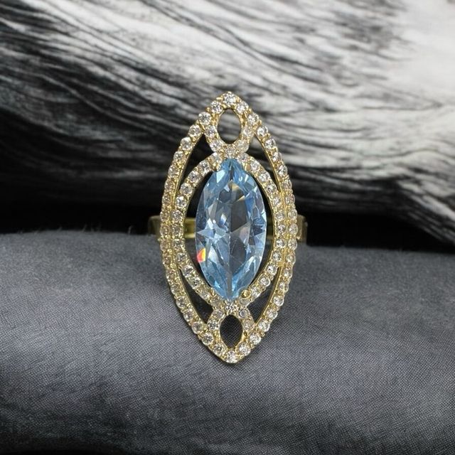 Anillo lanzadera oro 18k circonitas y piedra azul
