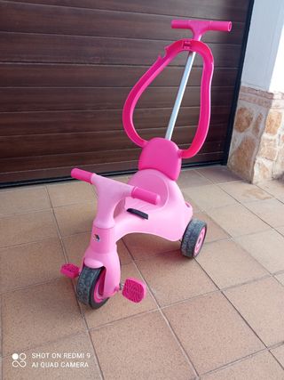 Triciclo rosa con sujeción y bloqueador