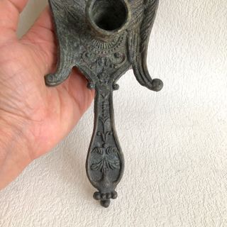 Antico portacandele grifone