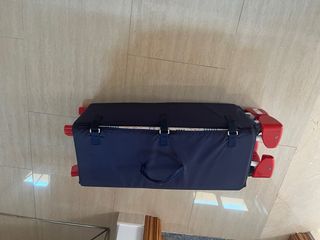 Cuna de viaje plegable azul con osito