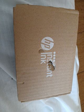 Caja precintada con dos tinta de impresora
