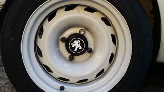Tapa centro de llanta peugeot 205 