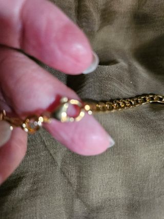 Collar con corazón dorado y plateado