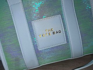 Bolso de mano con lentejuelas y reflejos