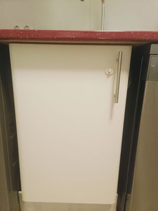 Cocina con lavadora y microondas