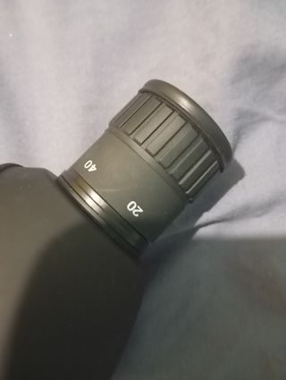 Lente de binóculo com bolsa