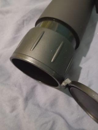 Lente de binóculo com bolsa