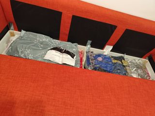 Divano letto angolare arancione con contenitore
