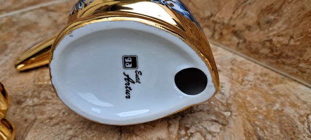 Figure in porcellana dorata stile Artur.