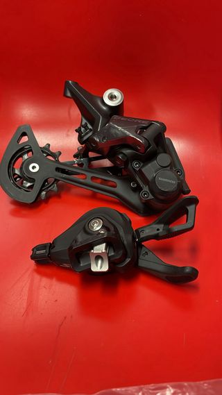Cambio trasero y pulsador Shimano Deore SLX 12v