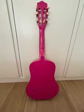 Guitarra infantil rosa .