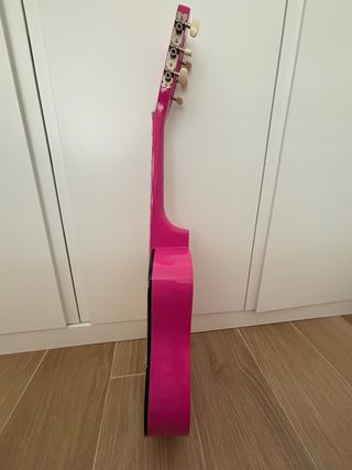 Guitarra infantil rosa .