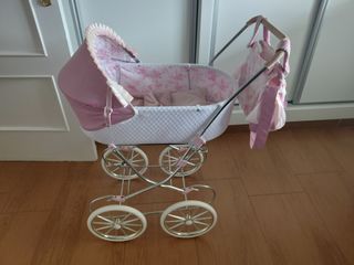 Carrito de muñecas rosa