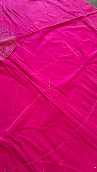 Capote de torear rosa