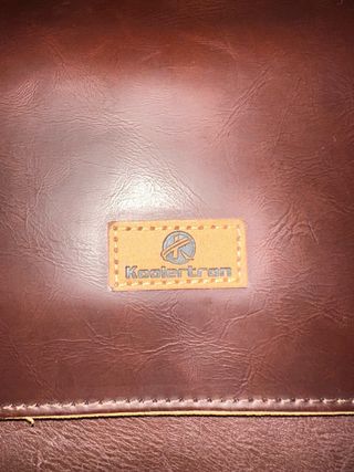 Cartera de mano de cuero marrón