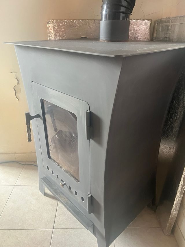 Estufa de leña como nueva o CAMBIO