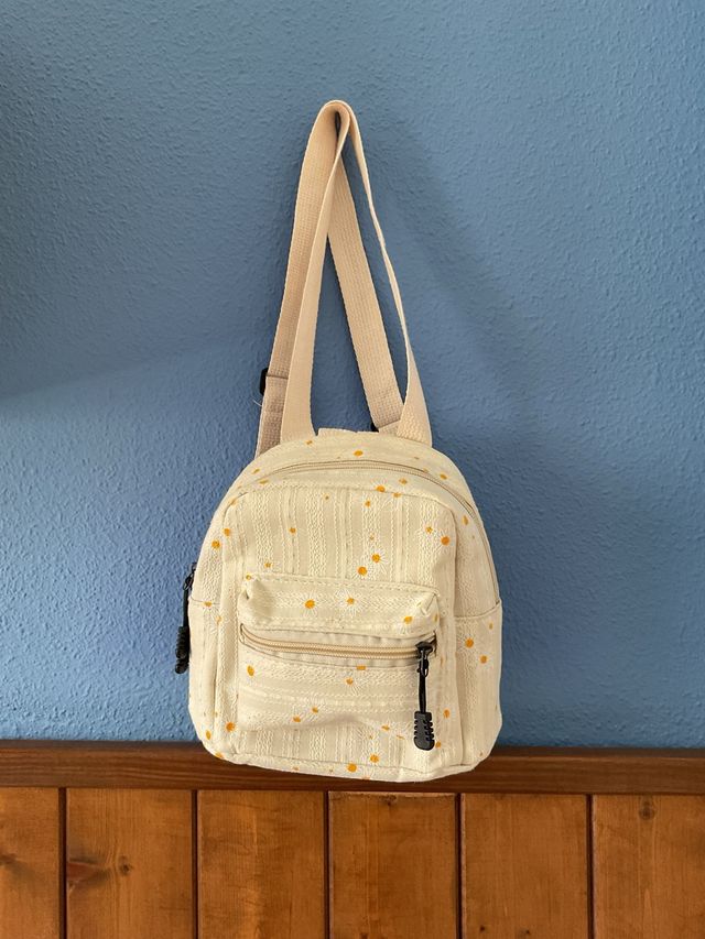 Mochila pequeña con estampado de margaritas
