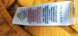 Camiseta Primark niña cuello barco mostaza