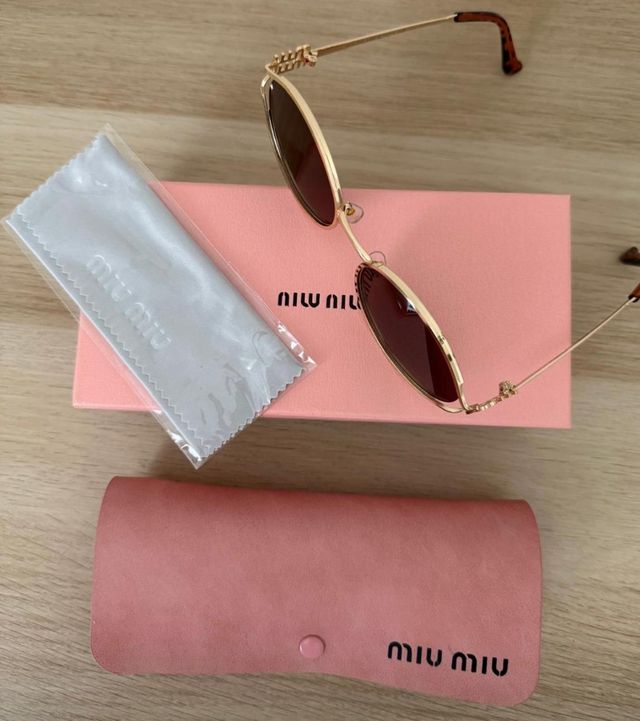 Gafas de sol Miu Miu doradas y marrones