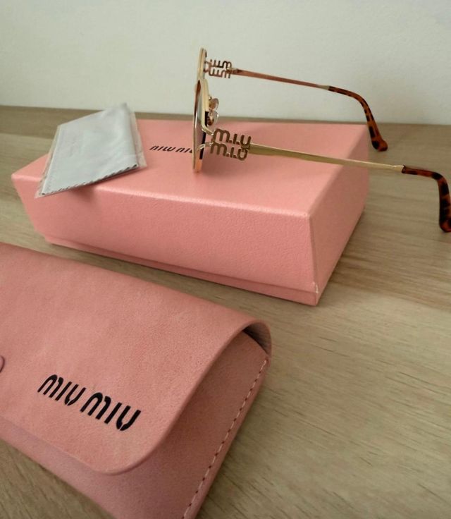 Gafas de sol Miu Miu doradas y marrones