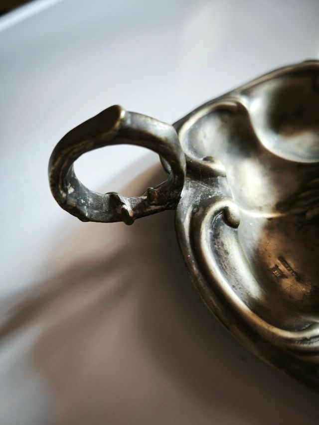 Dos palmatorias de plata  Meneses