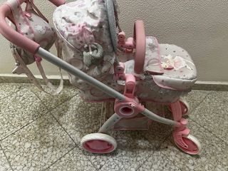 Carrito de muñecas rosa con unicornios