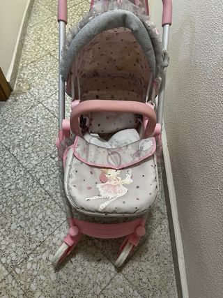 Carrito de muñecas rosa con unicornios