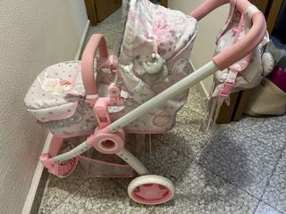Carrito de muñecas rosa con unicornios