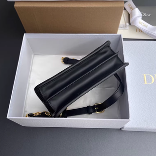 Borsa Dior nera e dorata da donna
