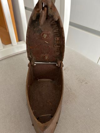 Plancha antigua de hierro fundido