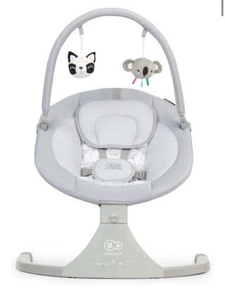 Mecedora bebé gris con arco de juegos