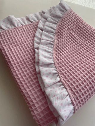Arrullo y neceser rosa con topos