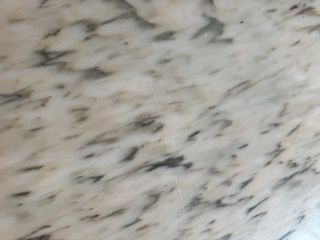 Mesa de comedor octogonal de mármol