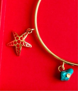 Pulsera Bimba y Lola dorada con estrellas y turque