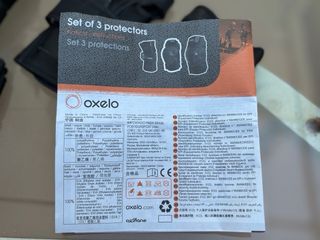 Casco rosa y protectores Oxelo