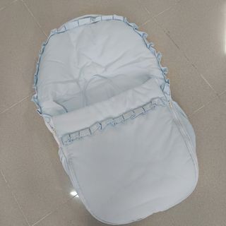 Saco bebé azul con volantes