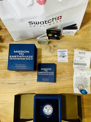 Omega Swatch Mission to Earthphase Moonshine Gold