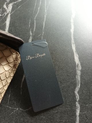 Bolso de mano tipo clutch piel serpiente
