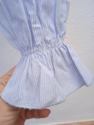 Blusa de niña a rayas celeste. T: 12 años