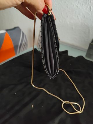 Cartera de fiesta negra y dorada