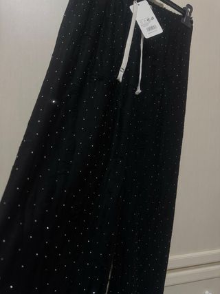Pantaloni neri brillantinati