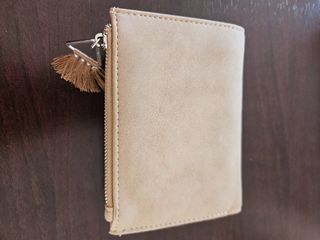 Cartera tejida beige y rosa con borla